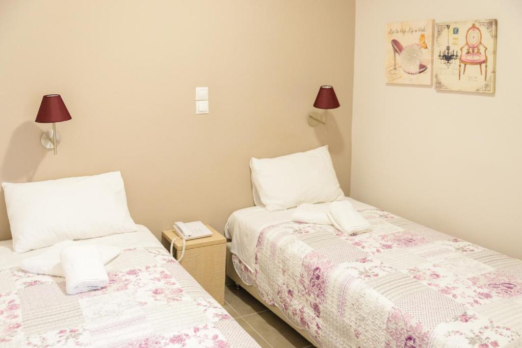 Ένα ή περισσότερα κρεβάτια σε δωμάτιο στο LUX Hotel