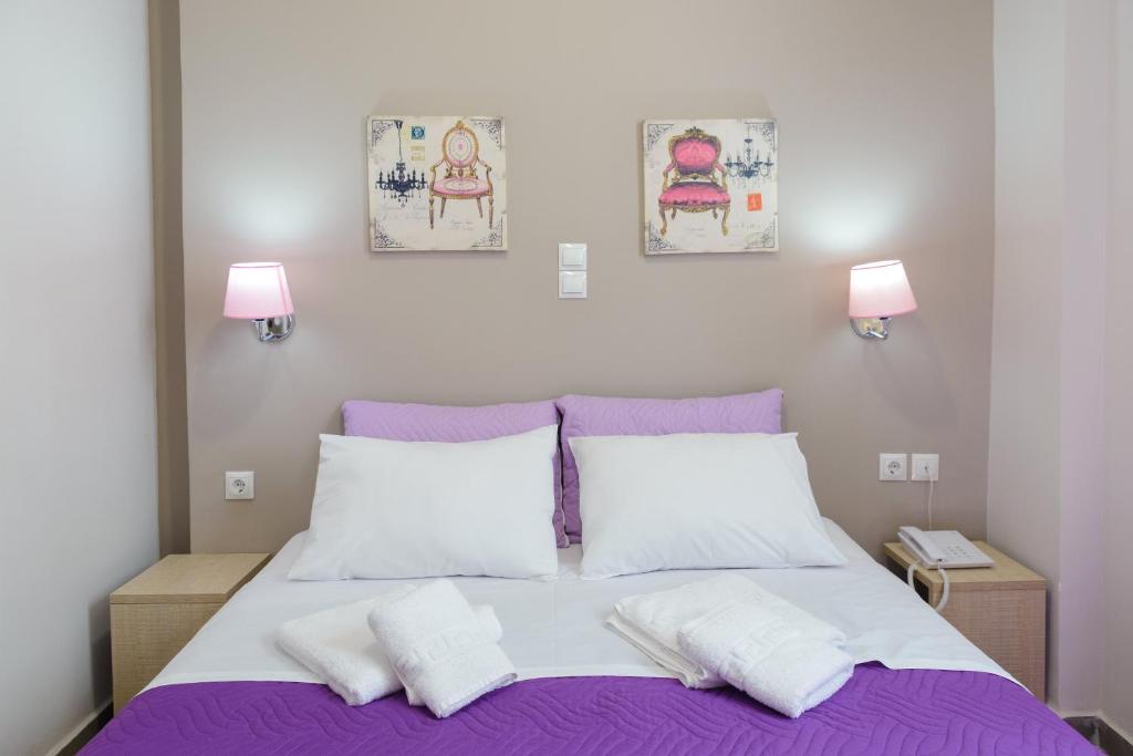 Ένα ή περισσότερα κρεβάτια σε δωμάτιο στο LUX Hotel
