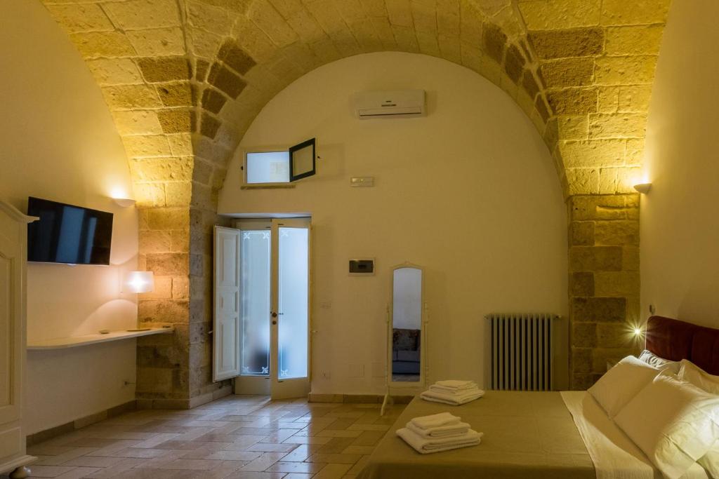 Postel nebo postele na pokoji v ubytování B&B Donnantonietta - Nobile dimora