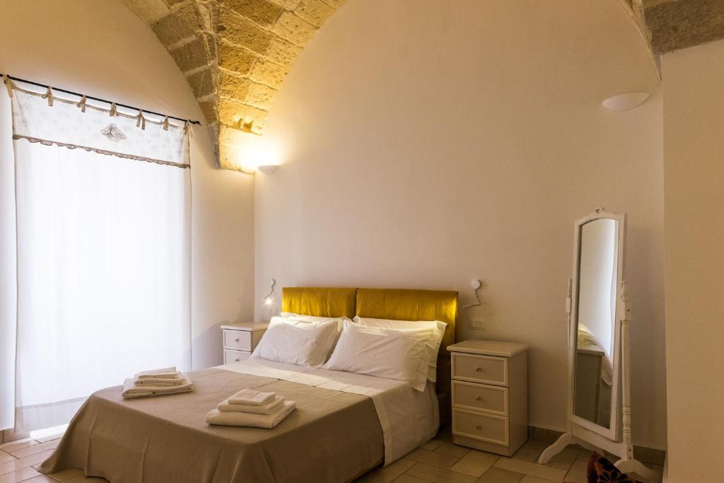Postel nebo postele na pokoji v ubytování B&B Donnantonietta - Nobile dimora