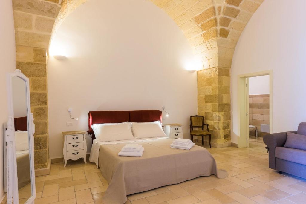 Postel nebo postele na pokoji v ubytování B&B Donnantonietta - Nobile dimora