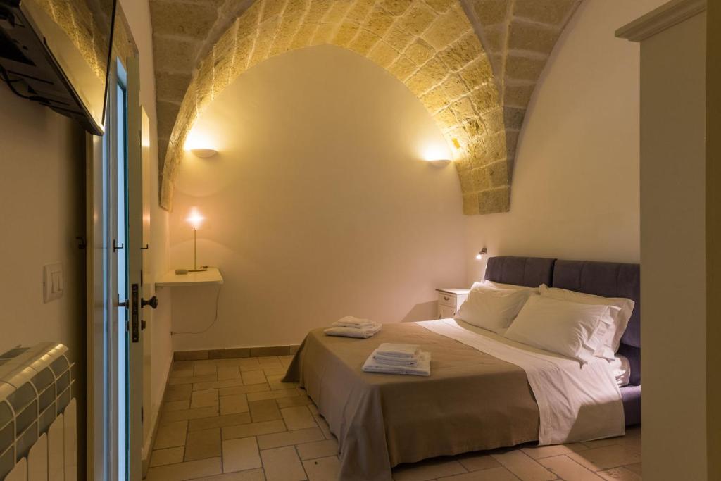 Postel nebo postele na pokoji v ubytování B&B Donnantonietta - Nobile dimora