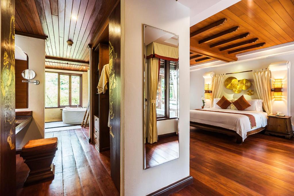 Postel nebo postele na pokoji v ubytování Muang Samui Spa Resort - SHA Extra Plus