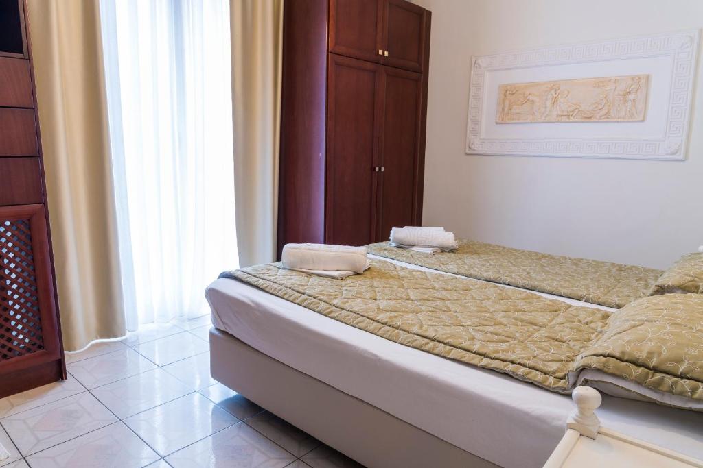 Postel nebo postele na pokoji v ubytování Hotel Zografos