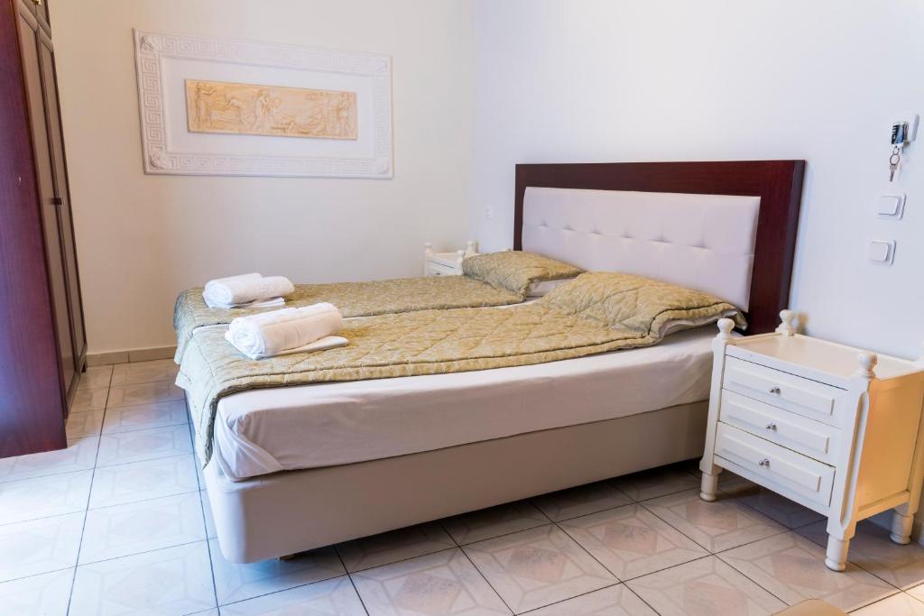 Postel nebo postele na pokoji v ubytování Hotel Zografos