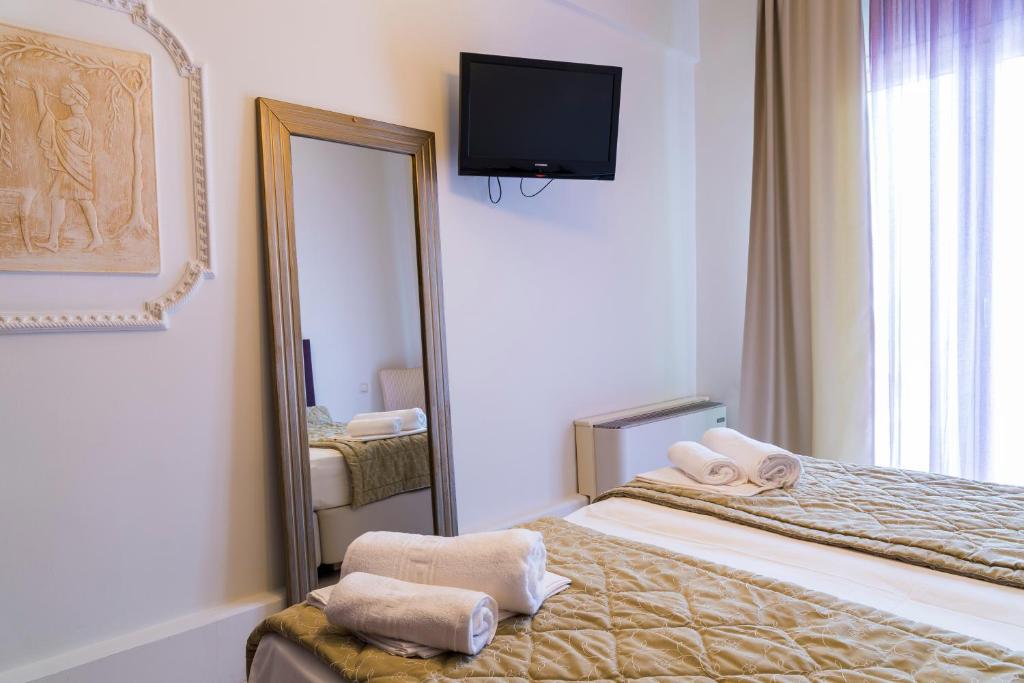 Postel nebo postele na pokoji v ubytování Hotel Zografos