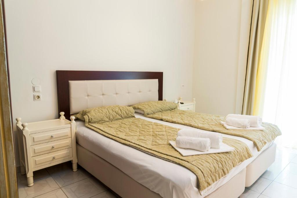 Postel nebo postele na pokoji v ubytování Hotel Zografos