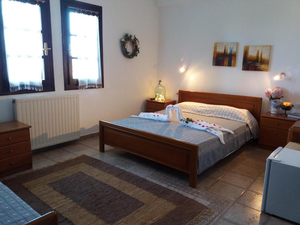 Postel nebo postele na pokoji v ubytování Dimosthenis Karastamatis Rooms