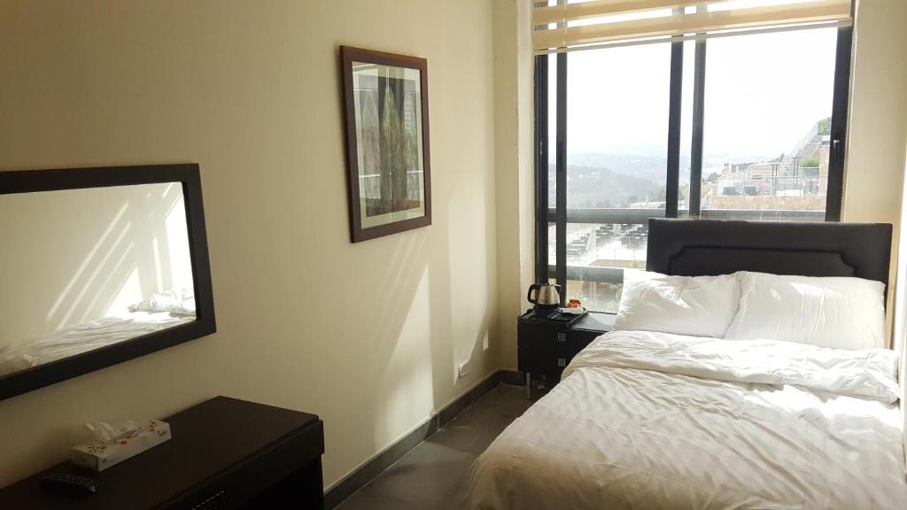 Postel nebo postele na pokoji v ubytování Sindyan Resort