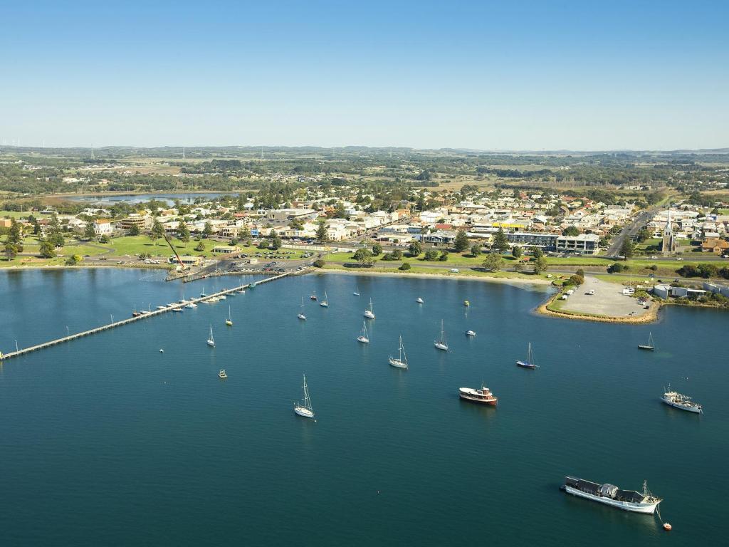 an aerial view of a harbor with boats in the water at NRMA Portland Bay Holiday Park in Portland
