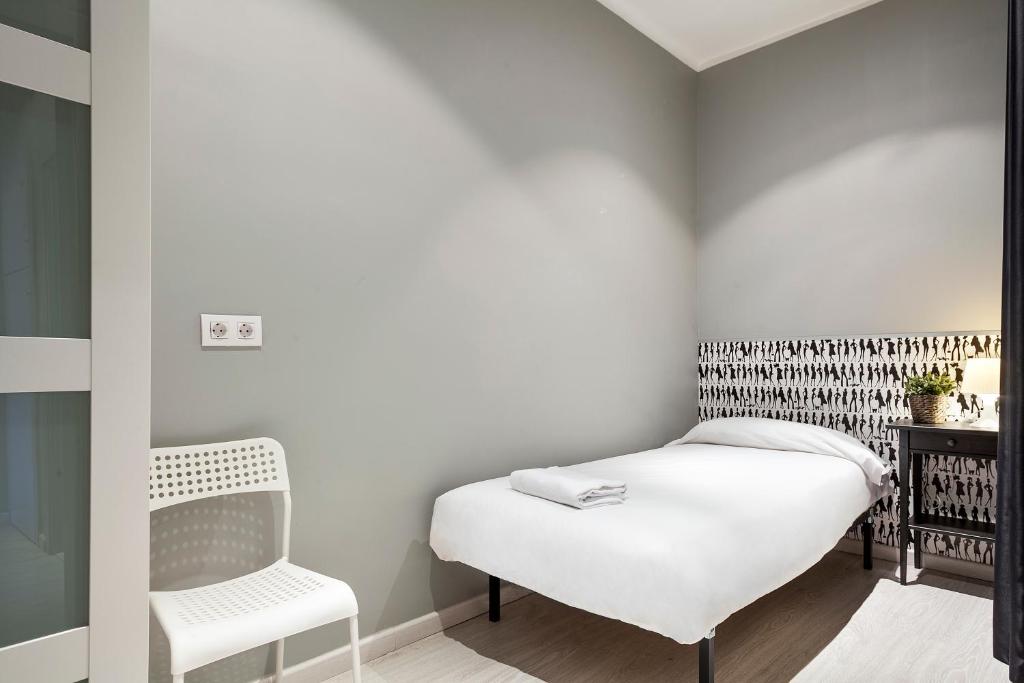 Posteľ alebo postele v izbe v ubytovaní Fira Apartments by gaiarooms