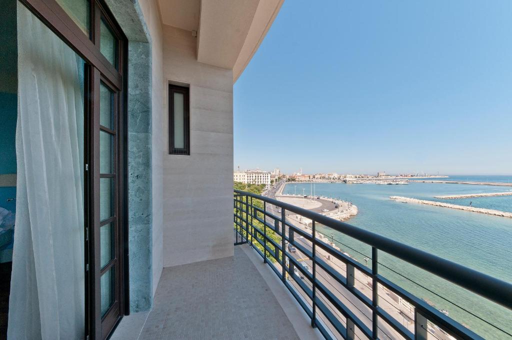 a balcony with a view of the beach at JR Hotels Bari Grande Albergo delle Nazioni in Bari