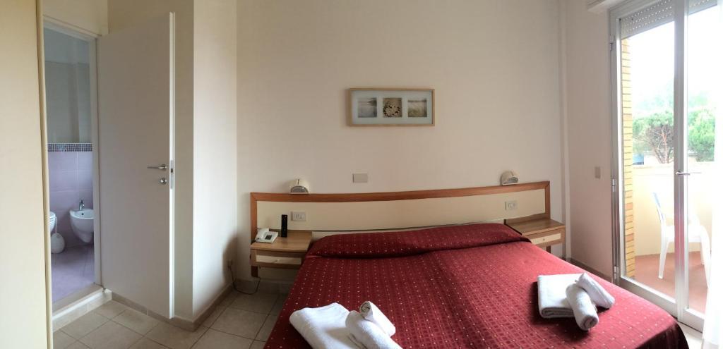 Postel nebo postele na pokoji v ubytování Hotel Real