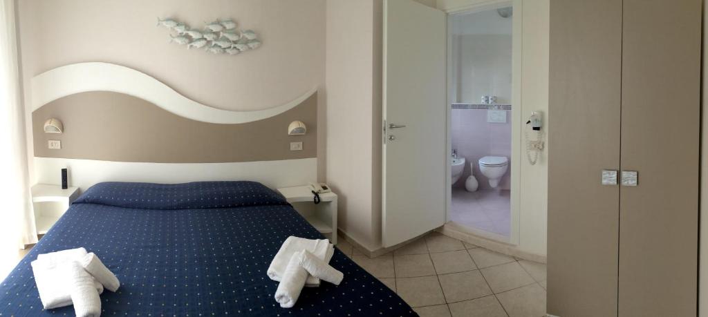 Postel nebo postele na pokoji v ubytování Hotel Real