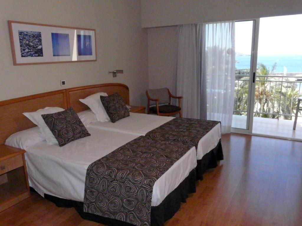 Cama o camas de una habitación en Hotel Tanit