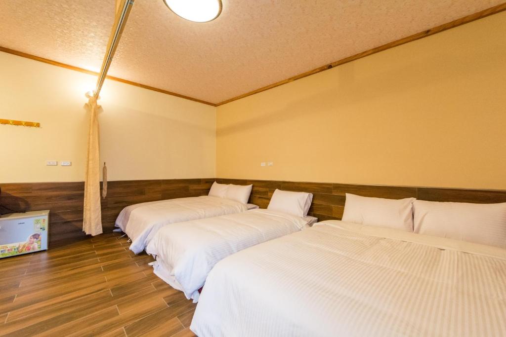 Postel nebo postele na pokoji v ubytování Donglifang B&B