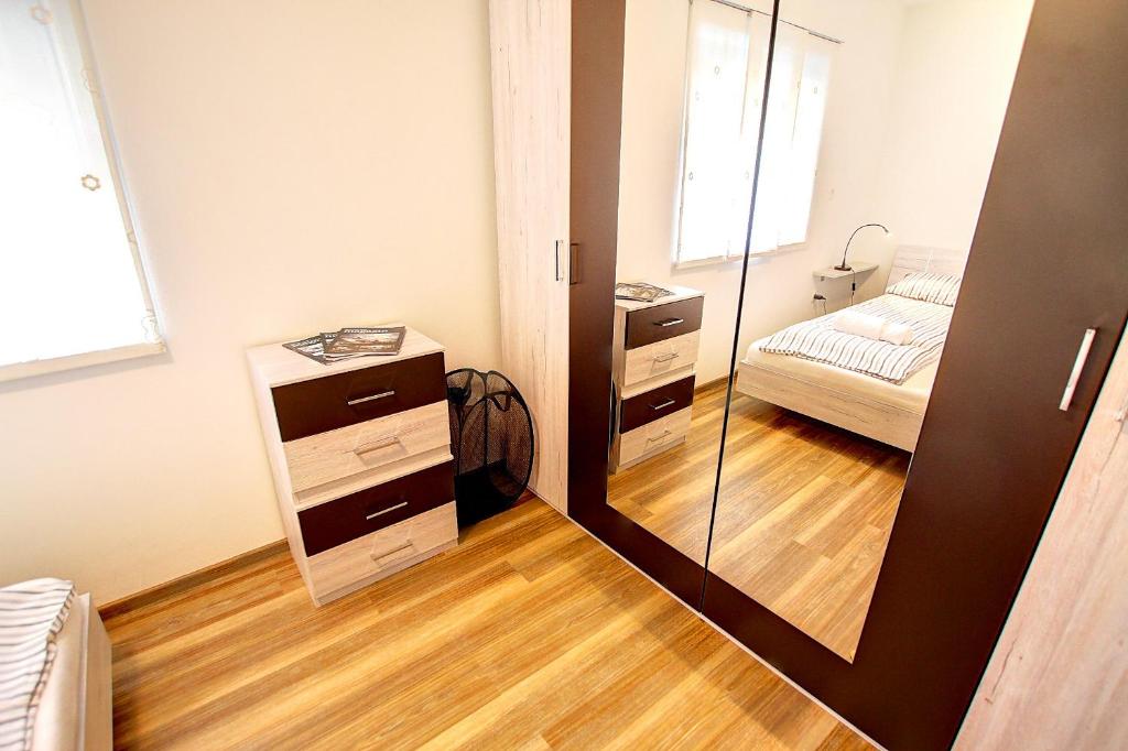 Postel nebo postele na pokoji v ubytování Apartment Vita near Terme Paradiso