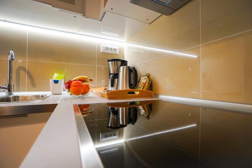 Kuchyňa alebo kuchynka v ubytovaní Destino City Apartments