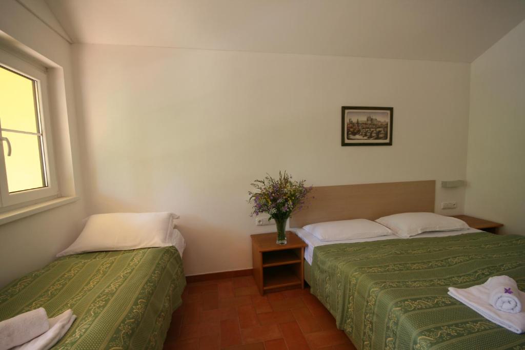 Postel nebo postele na pokoji v ubytování Resort Beach Nová Živohošť