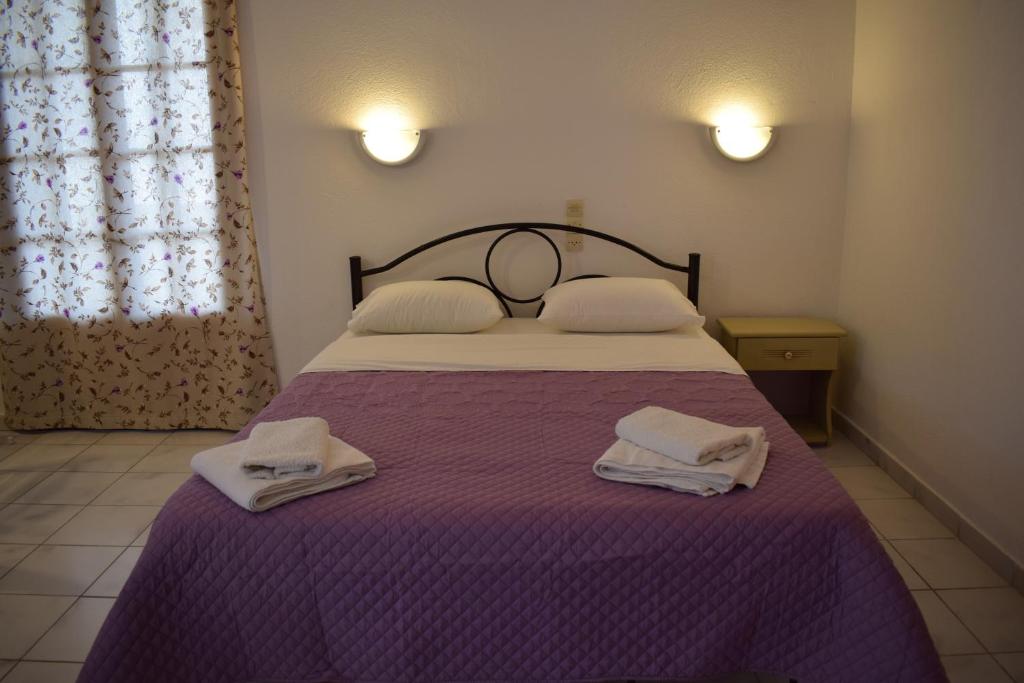 Postel nebo postele na pokoji v ubytování Gorgona apartments & studios