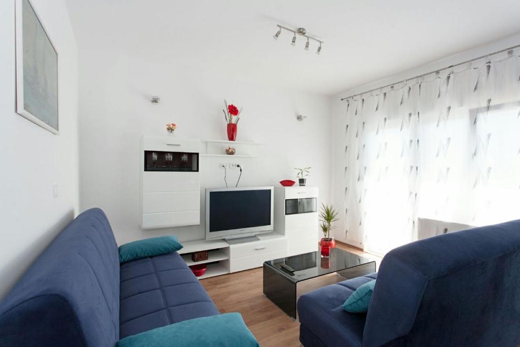 TV a/nebo společenská místnost v ubytování Apartmani Jukic