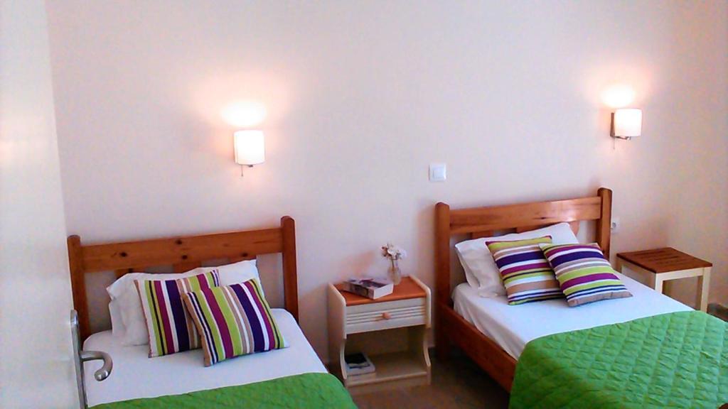 Postel nebo postele na pokoji v ubytování Gorgona apartments & studios