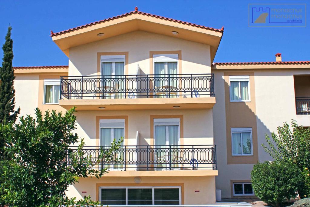 a building with balconies on the side of it at Monachus Monachus in Frangokastello