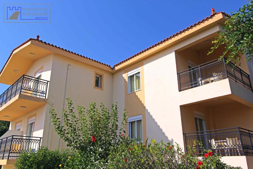 a building with balconies on the side of it at Monachus Monachus in Frangokastello