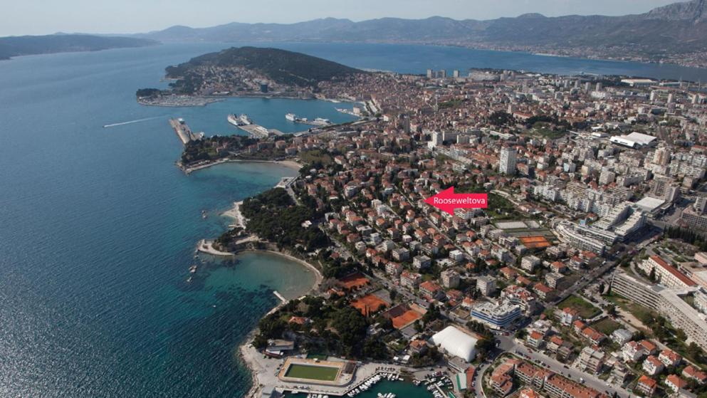 an aerial view of a city next to the water at Apartments Beautiful Sandy Beach in Split