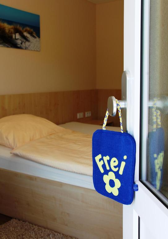 Postel nebo postele na pokoji v ubytování Pension Am Ziegelwall