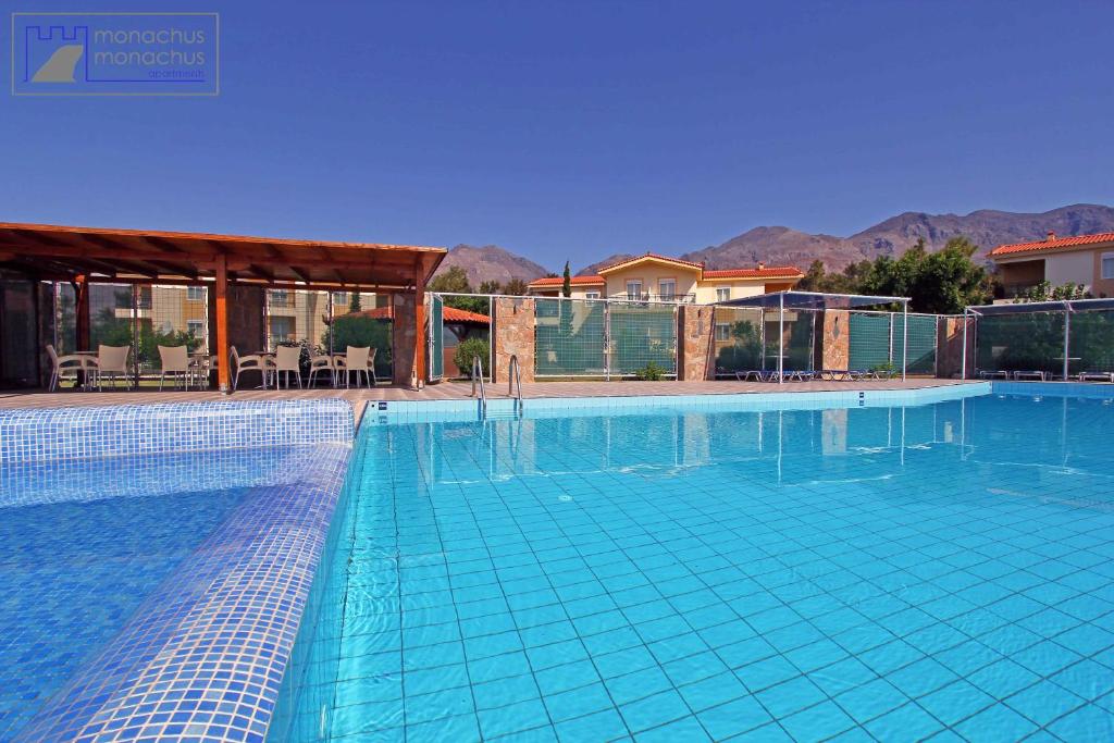 a large swimming pool with blue tiles on it at Monachus Monachus in Frangokastello