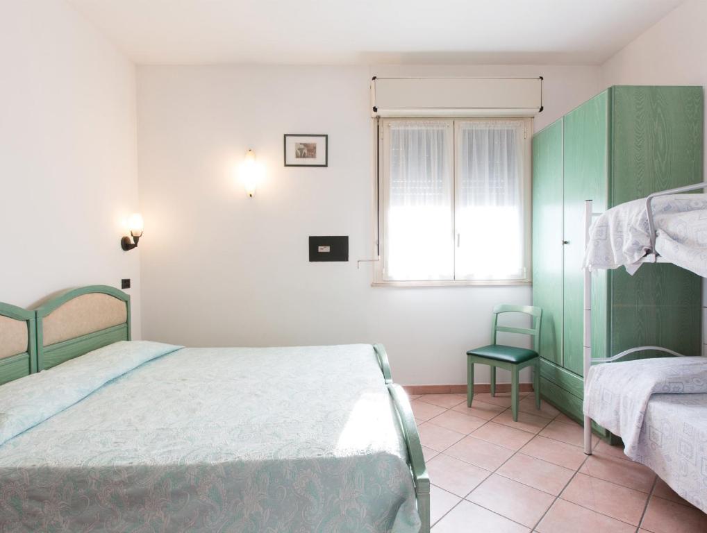 Postel nebo postele na pokoji v ubytování Albergo Cenni