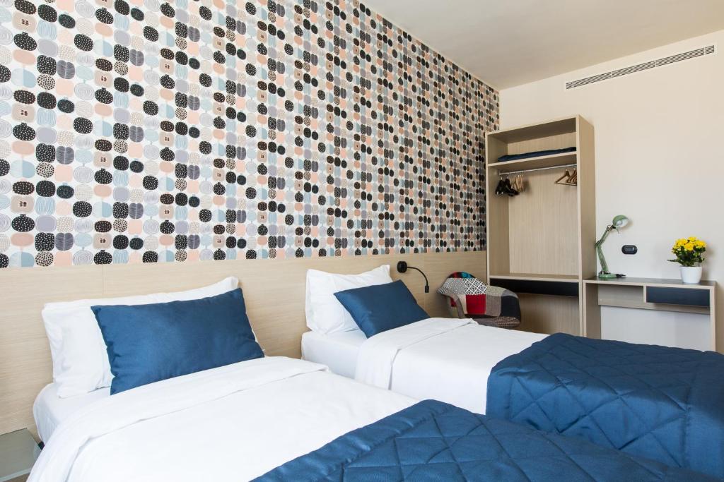 Postel nebo postele na pokoji v ubytování Aparthotel Isola