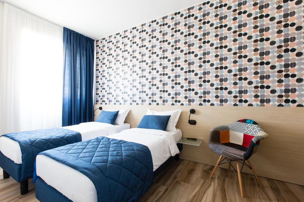 Postel nebo postele na pokoji v ubytování Aparthotel Isola