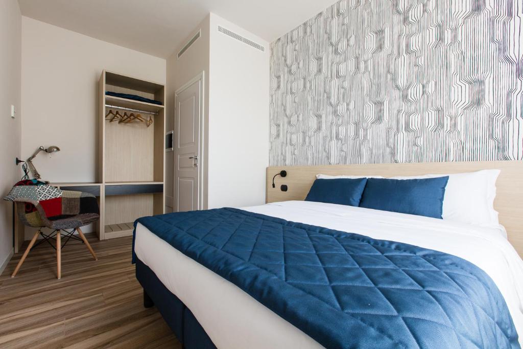 Postel nebo postele na pokoji v ubytování Aparthotel Isola