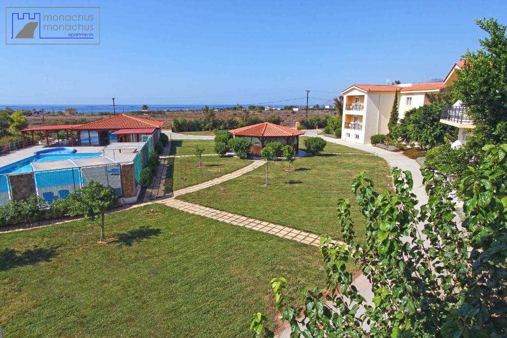 a villa with a swimming pool and a garden at Monachus Monachus in Frangokastello