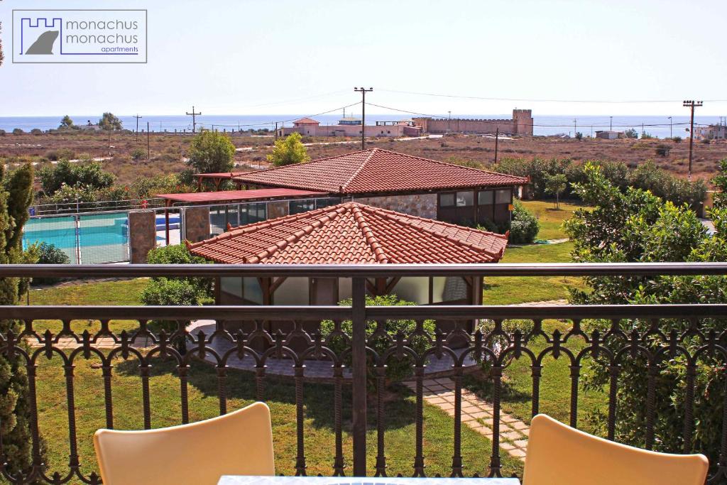 a view from the balcony of a house with a pool at Monachus Monachus in Frangokastello
