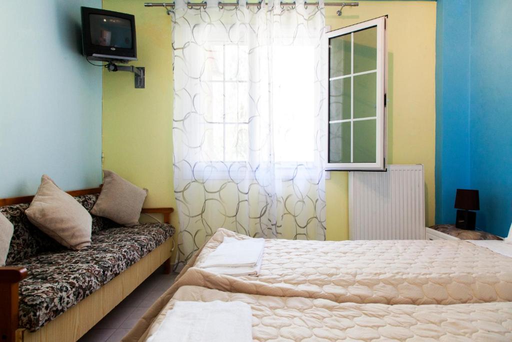 Postel nebo postele na pokoji v ubytování Zois' House