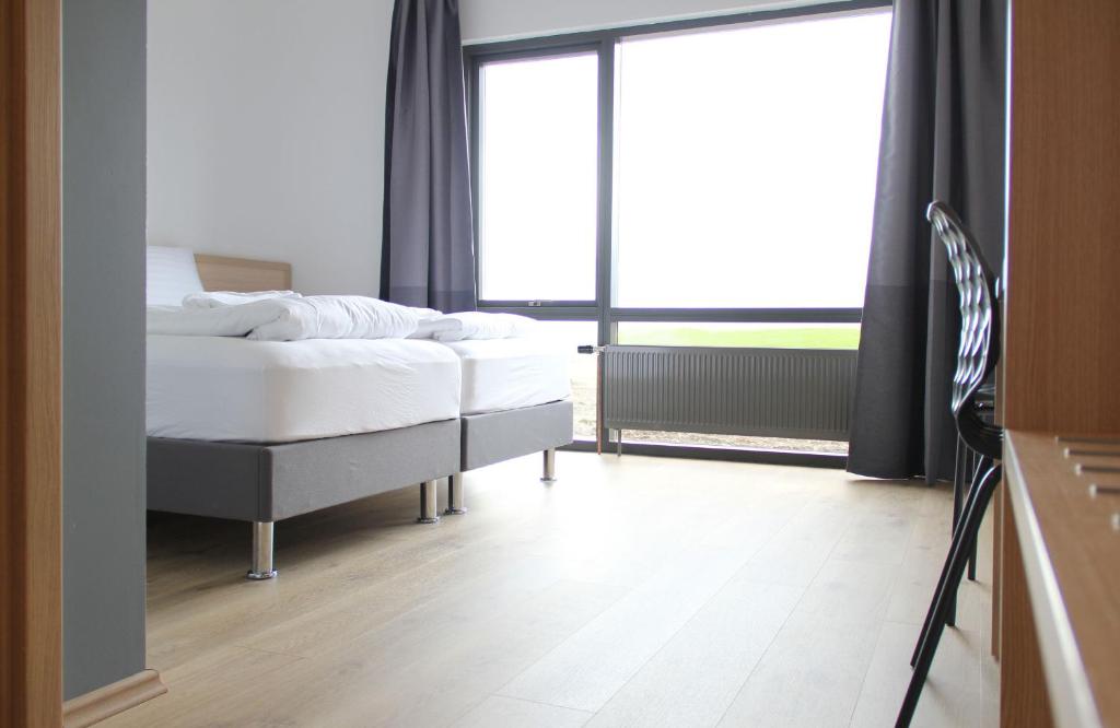 Postel nebo postele na pokoji v ubytování Lilja Guesthouse