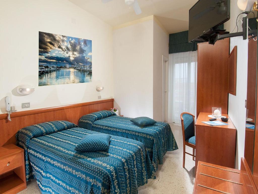 Postel nebo postele na pokoji v ubytování Hotel caesar
