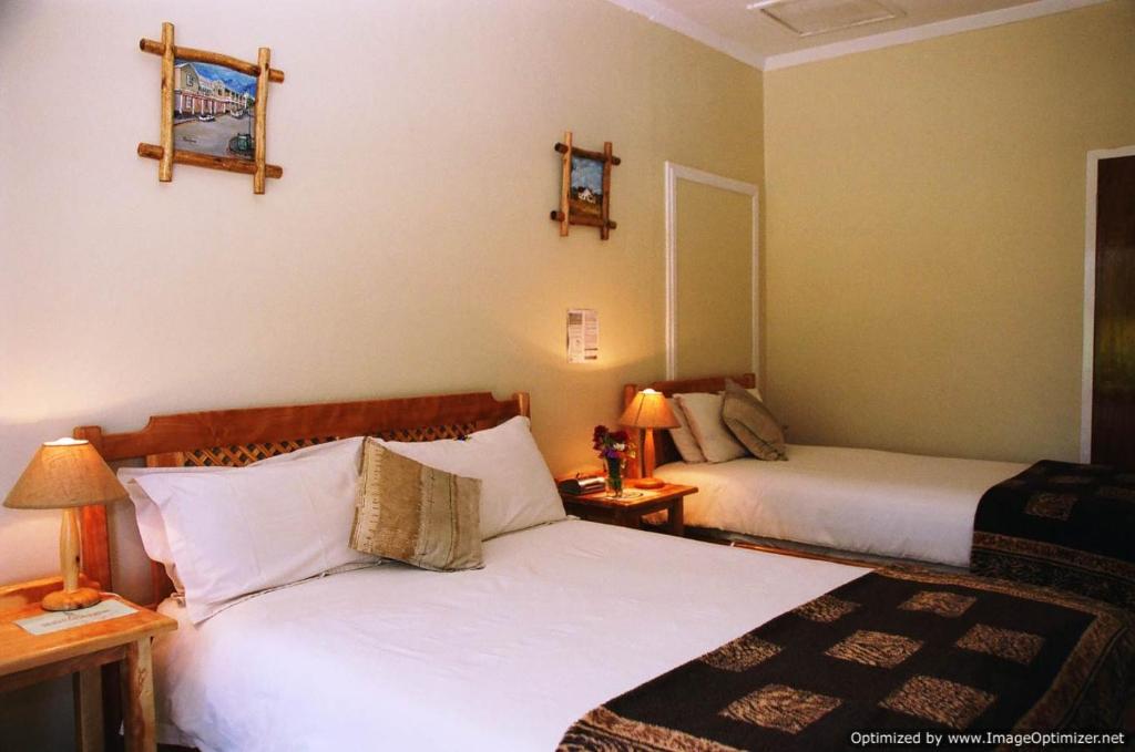 Postel nebo postele na pokoji v ubytování Colesview Guest House