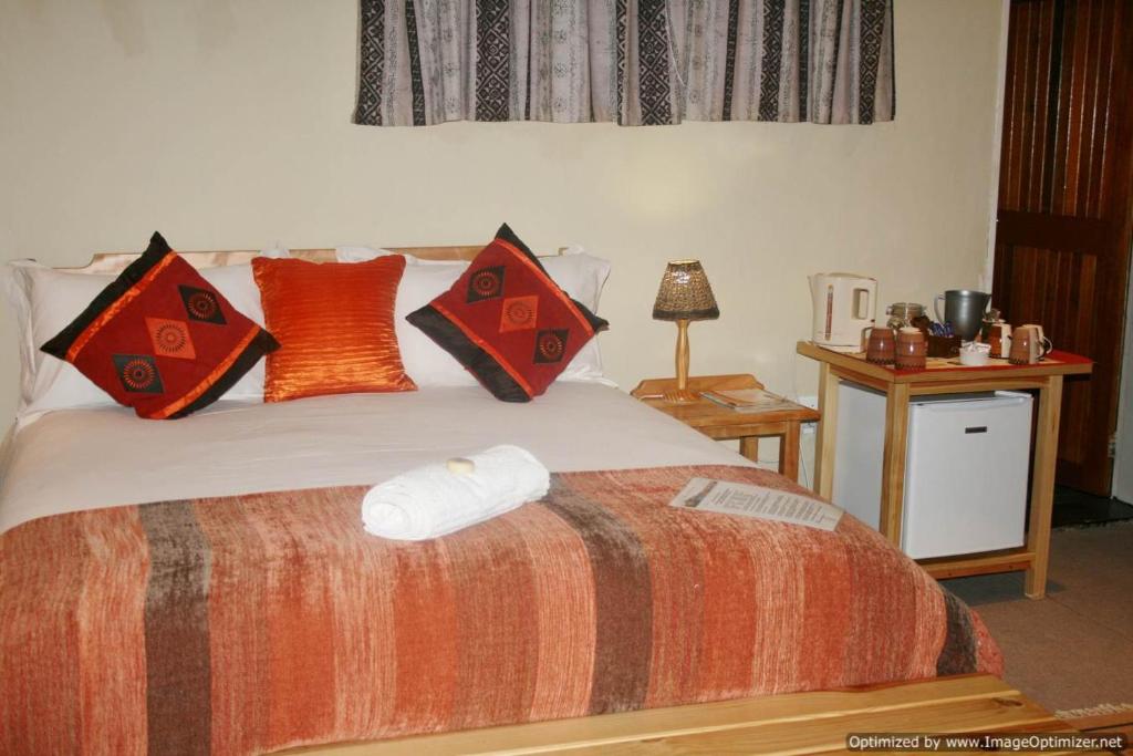 Postel nebo postele na pokoji v ubytování Colesview Guest House