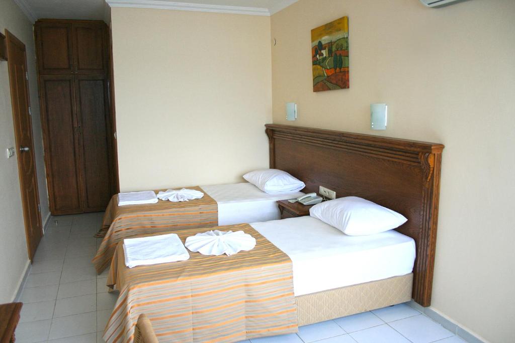 Tempat tidur dalam kamar di Honeymoon Beach Marmaris