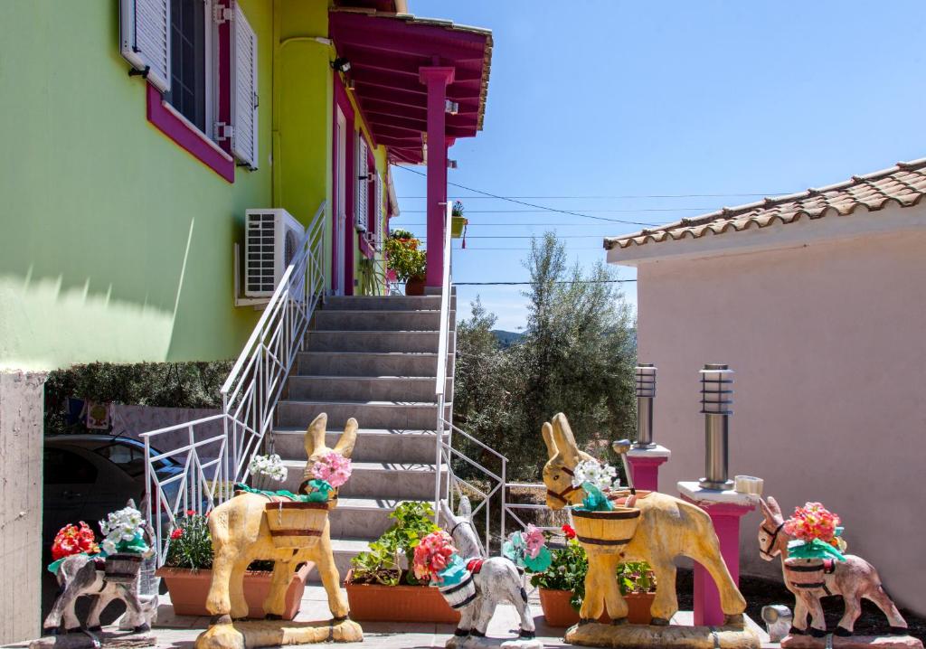 a group of animals in front of a house at Zois' House in Sívros