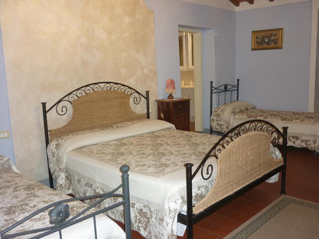 Postel nebo postele na pokoji v ubytování B&B Casale Ginette