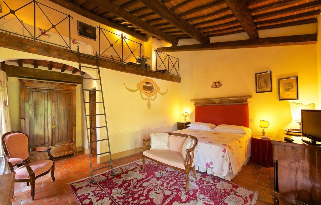 Postel nebo postele na pokoji v ubytování Relais Villa Baldelli