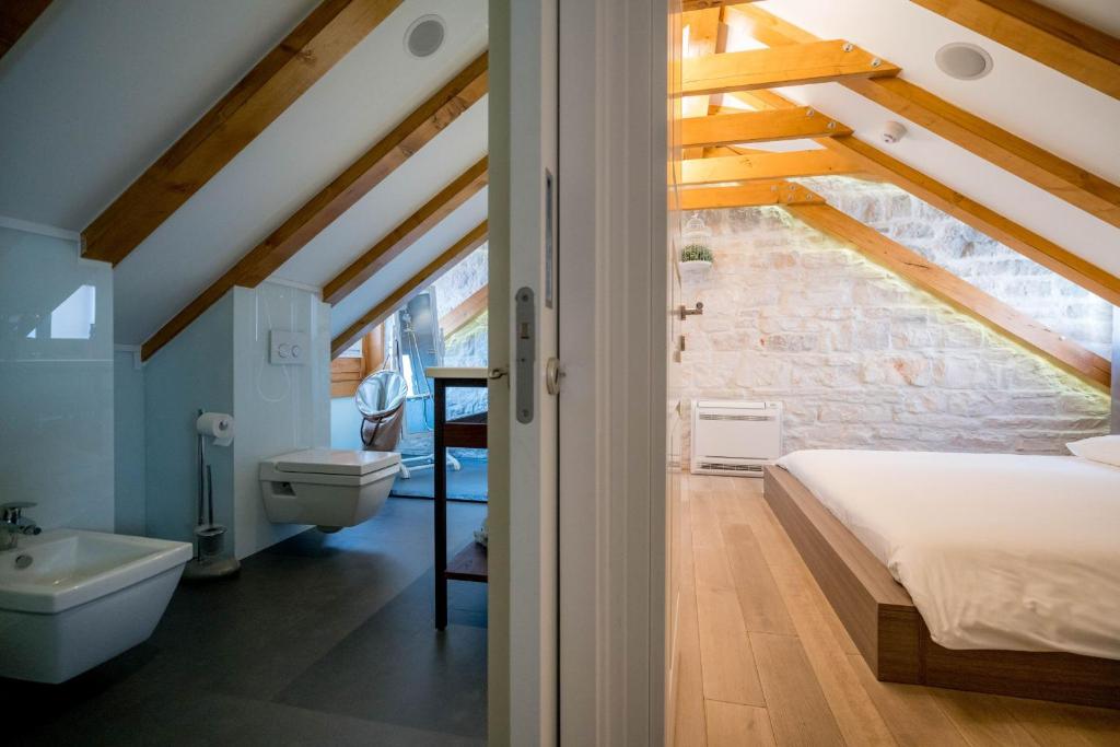 Postel nebo postele na pokoji v ubytování Apartment Atticus
