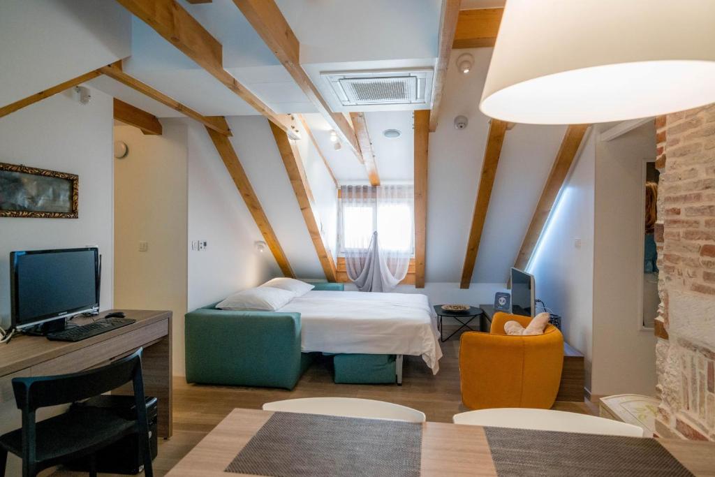 Postel nebo postele na pokoji v ubytování Apartment Atticus