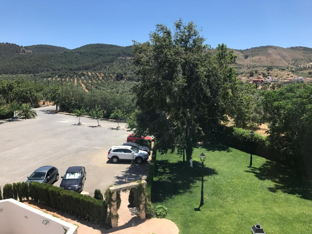 arial view of a parking lot with cars parked at Los Dólmenes in Antequera