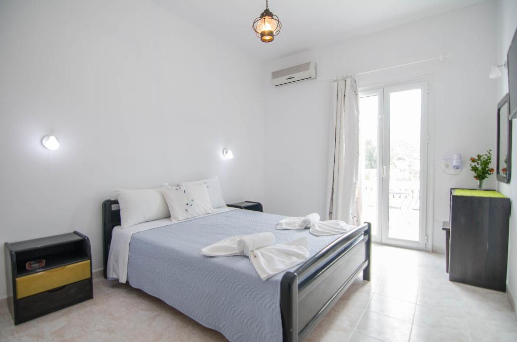 Postel nebo postele na pokoji v ubytování Hotel Delfini